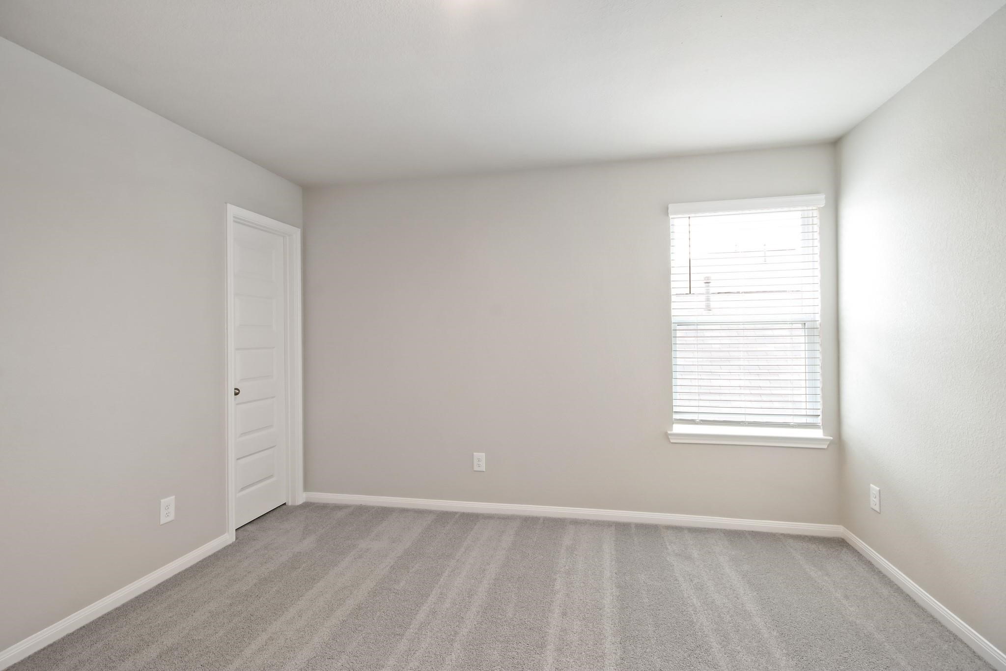 2416 Bluefish Court Conroe, TX 77384 - Photo 10 of 45 an empty room with a window