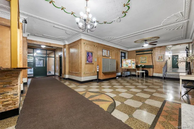 a view of a hall with wooden floor