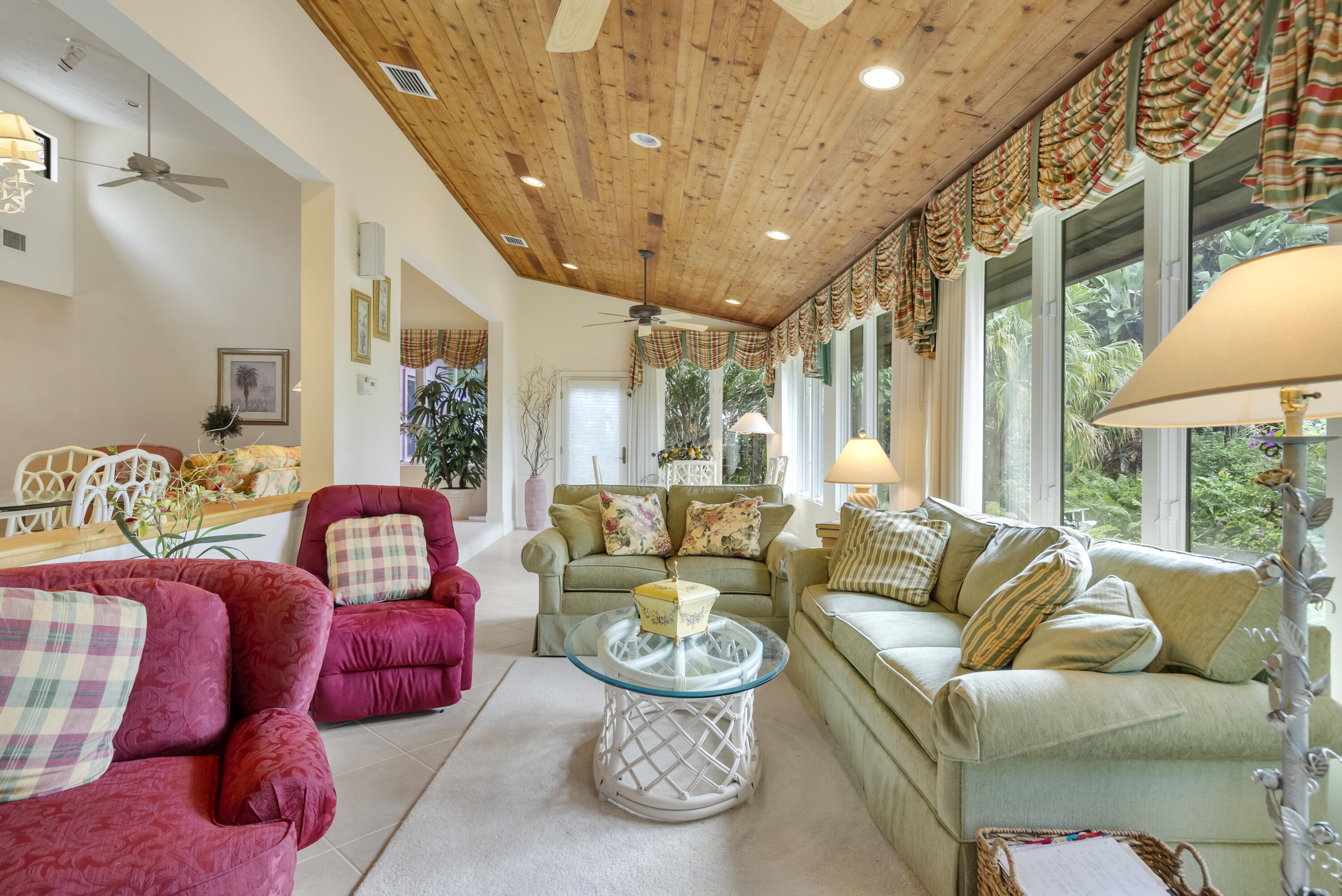 5011 Southeast Burning Tree Circle Stuart, FL 34997 - Photo 20 of 58 a living room with furniture and a large window