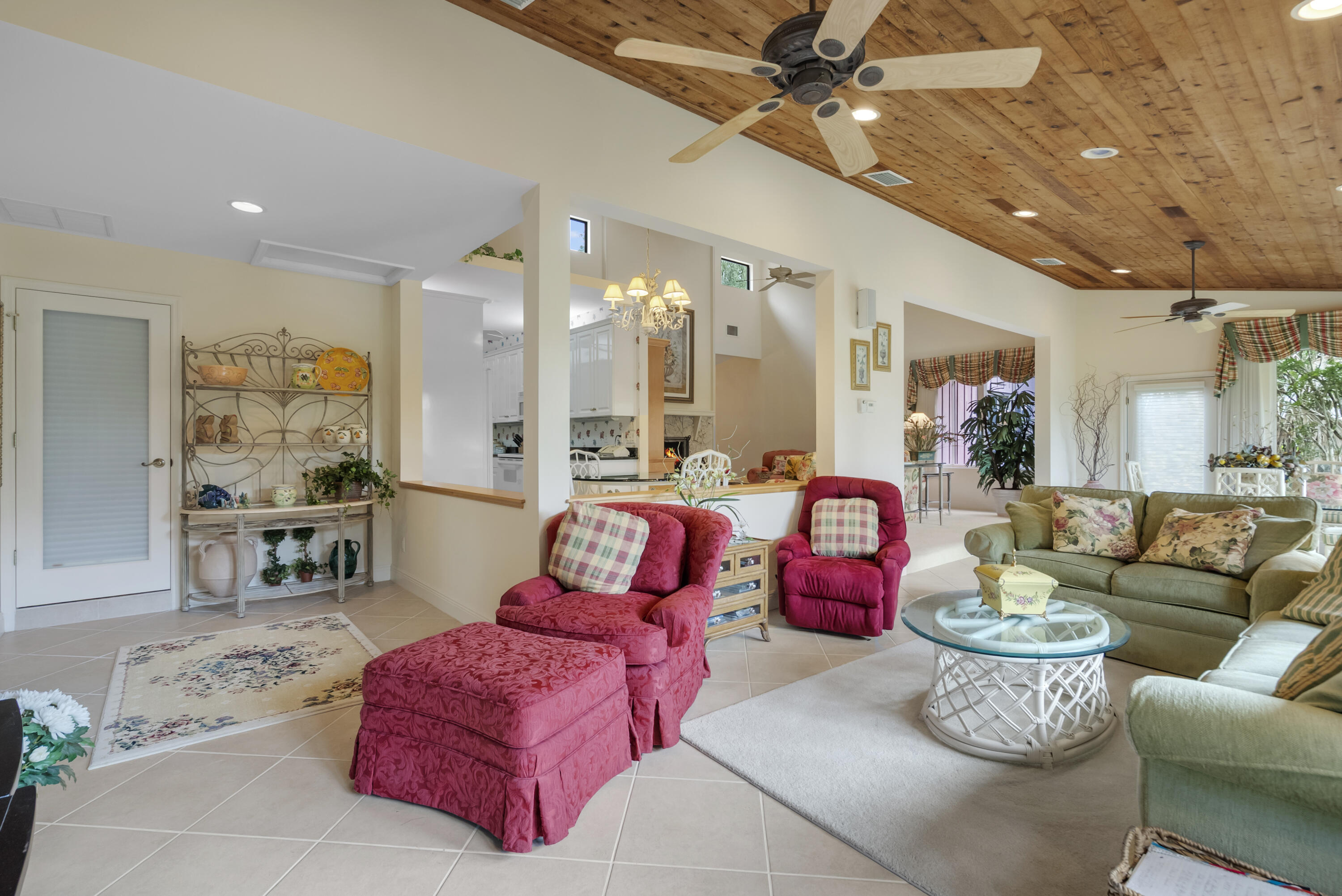 5011 Southeast Burning Tree Circle Stuart, FL 34997 - Photo 22 of 58 a living room with patio furniture and kitchen view