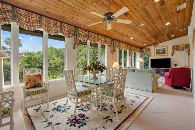a bedroom with bed and ceiling fan