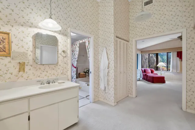 a bathroom with a bathtub and shower