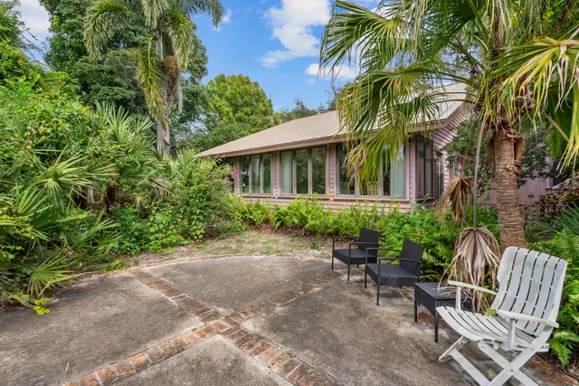 an aerial view of a house with a swimming pool outdoor seating and yard