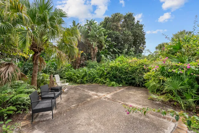 an aerial view of a house with swimming pool yard and outdoor seating