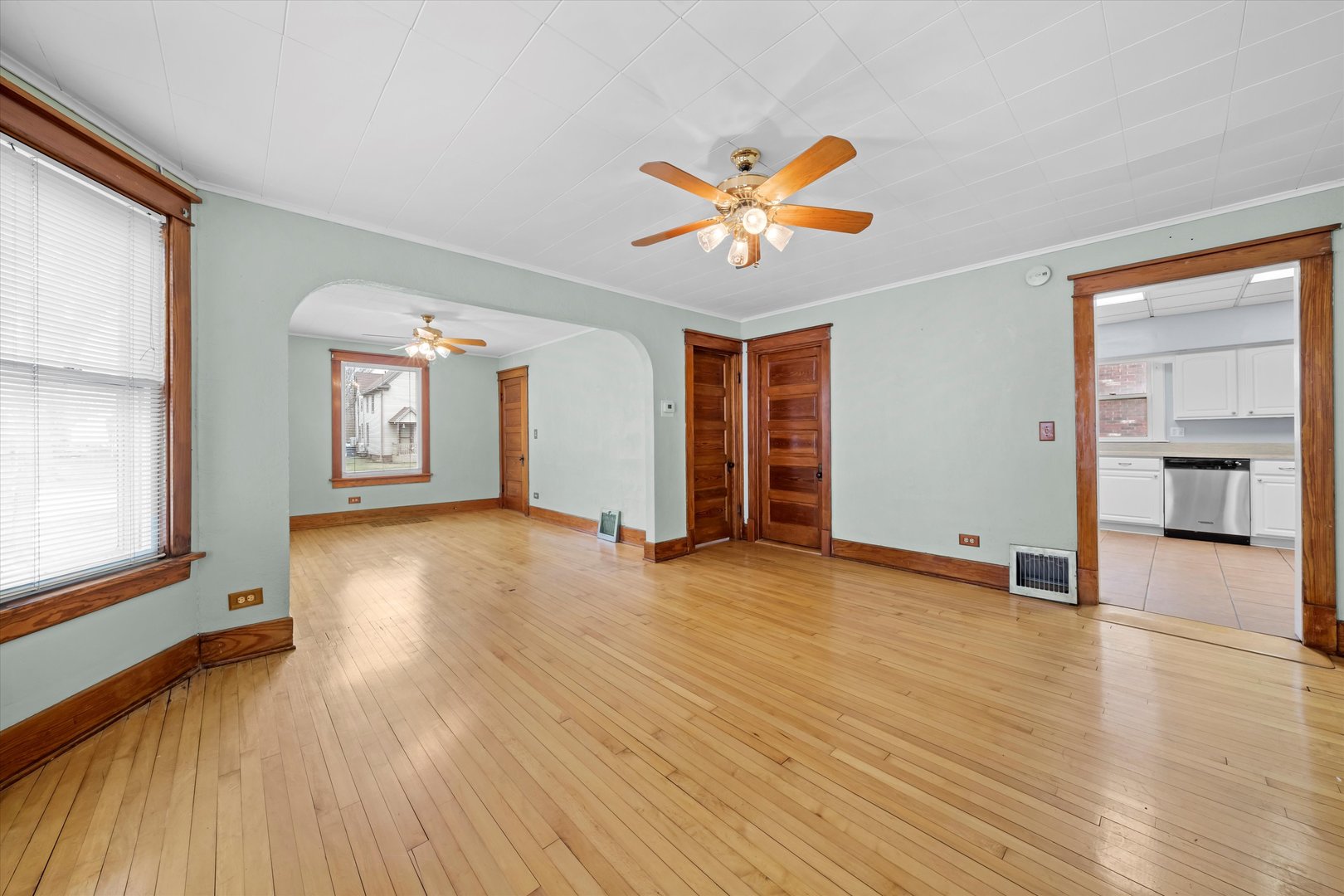 1443 Main Street Crete, IL 60417 - Photo 6 of 19 a view of an empty room with window and wooden floor