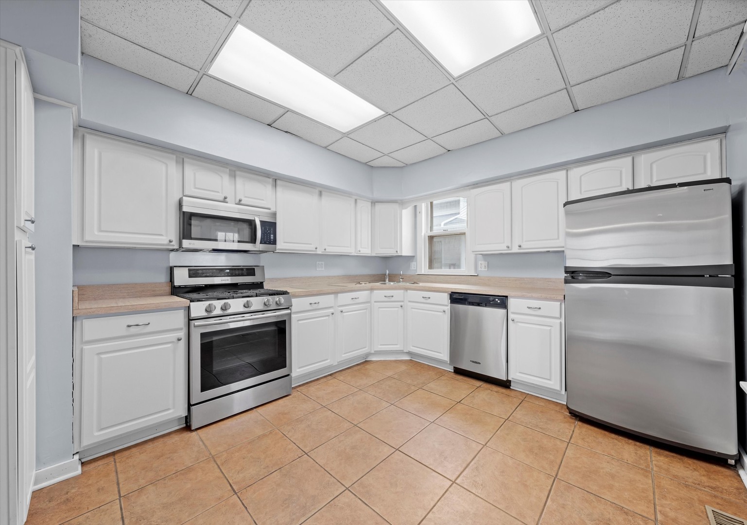 1443 Main Street Crete, IL 60417 - Photo 7 of 19 a kitchen with cabinets stainless steel appliances and a counter space