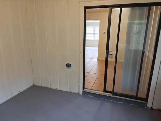 an empty room with mirror