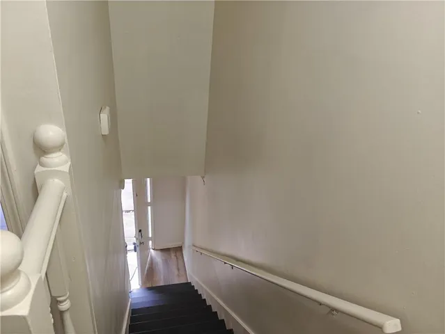 a view of entryway with wooden floor