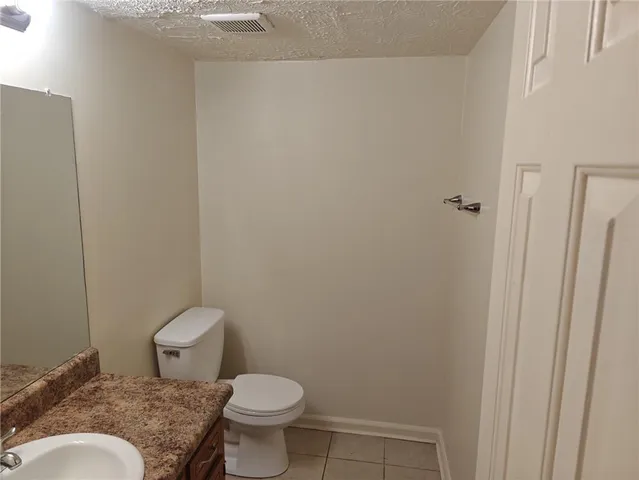 a bathroom with a toilet and a sink