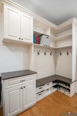 a bedroom with a bed flat screen tv and dresser