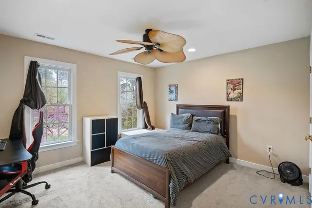 a living room with furniture flowerpot and window