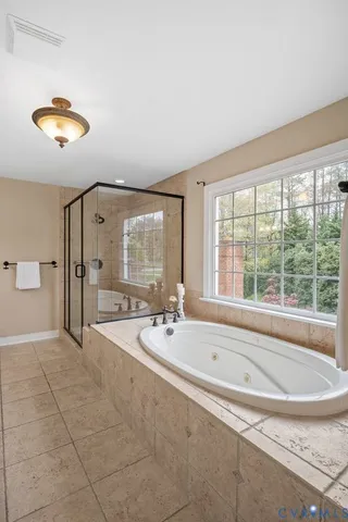 a backyard of a house with barbeque oven table and chairs