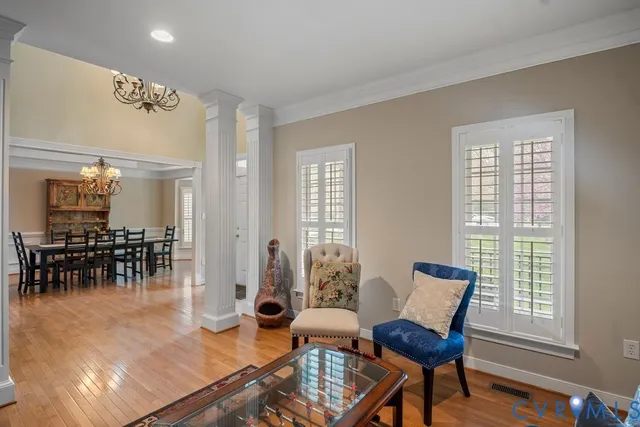 a view of a dining room with furniture and wooden floor