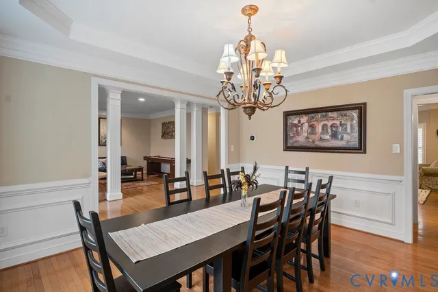 a living room with furniture and view of kitchen