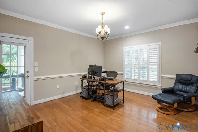 a kitchen with granite countertop a refrigerator and cabinets