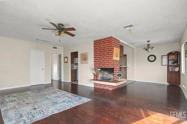 a view of a house with a swimming pool and a yard