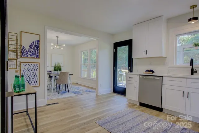 a kitchen with a table and chairs in it
