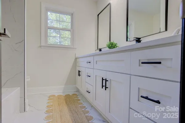 a bathroom with a bathtub and a sink