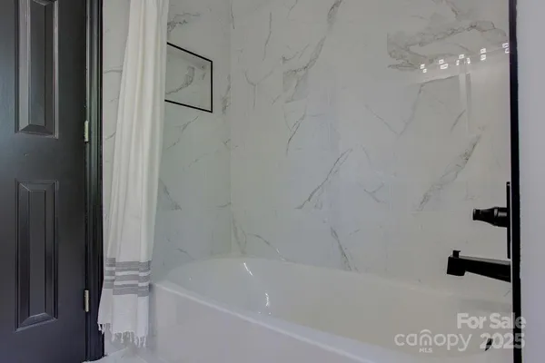 a bathroom with a bathtub