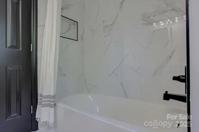 a bathroom with a bathtub