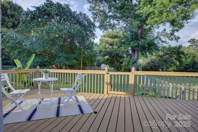 a view of deck with wooden floor and outdoor seating