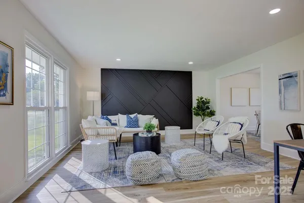a living room with furniture and a large window