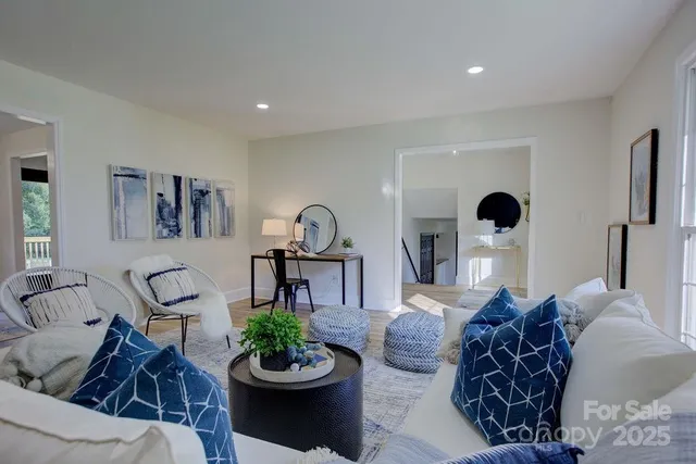 a living room with furniture and a large window