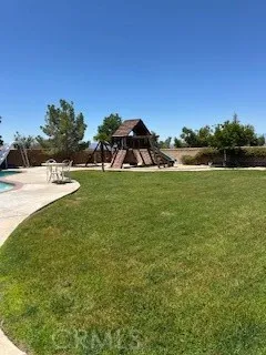 a view of a lake with a yard