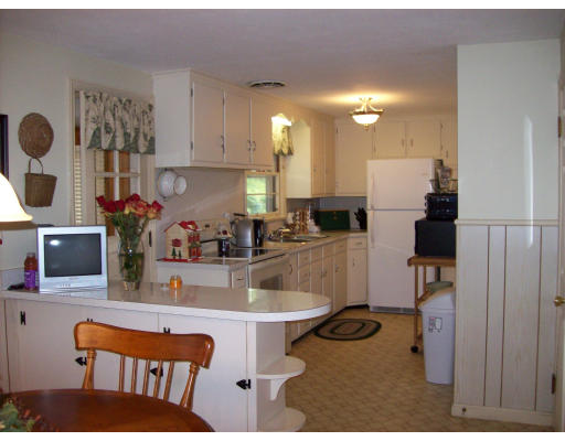 72 West Allen Ridge Road Springfield, MA 01118 - Photo 10 of 16 a kitchen with a sink cabinets and dining table