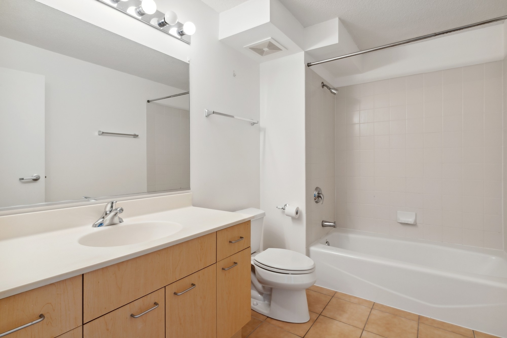 800 Elgin Road, Unit 1109 Evanston, IL 60201 - Photo 11 of 17 a bathroom with a sink a toilet and shower