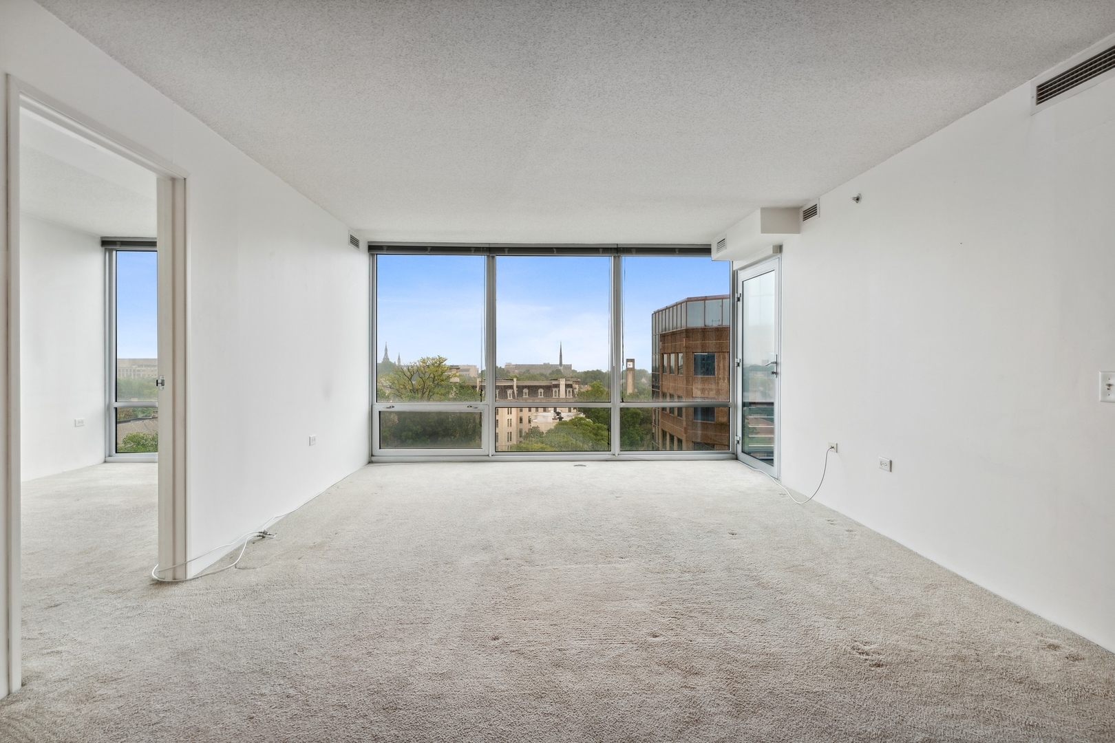 800 Elgin Road, Unit 1109 Evanston, IL 60201 - Photo 2 of 17 a view of an empty room with a fireplace