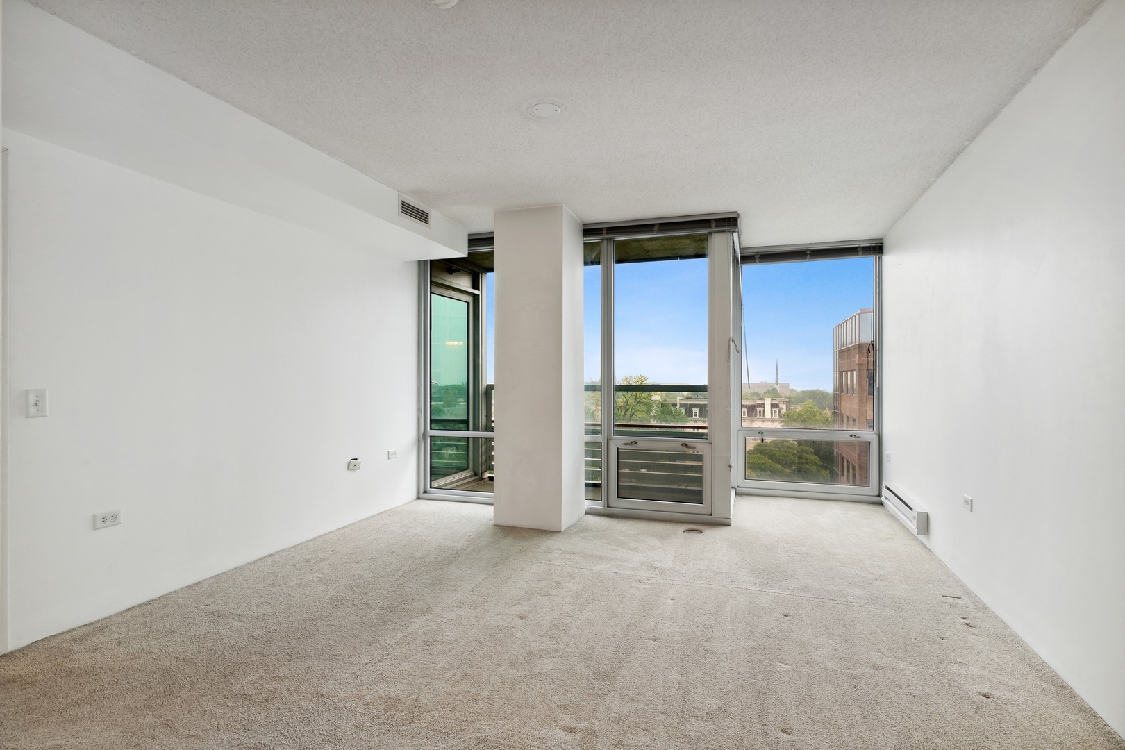 800 Elgin Road, Unit 1109 Evanston, IL 60201 - Photo 7 of 17 an empty room with furniture and closet
