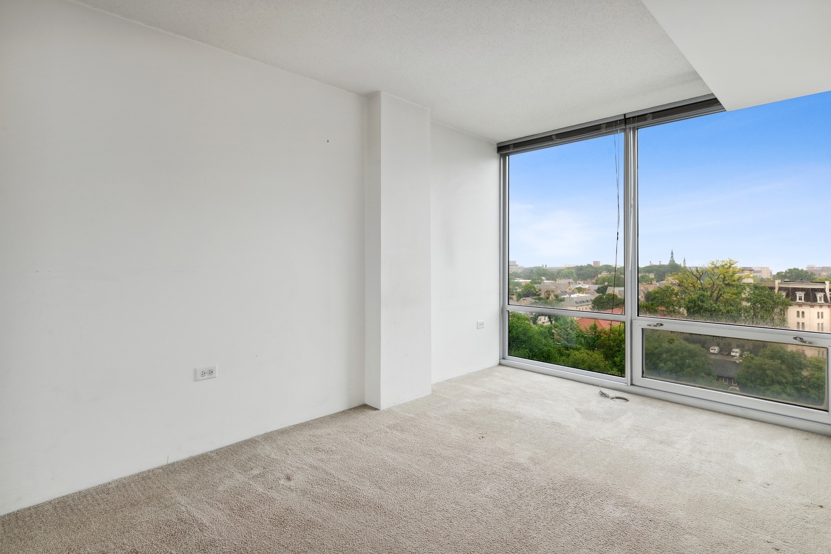 800 Elgin Road, Unit 1109 Evanston, IL 60201 - Photo 10 of 17 a view of a room that has a large window