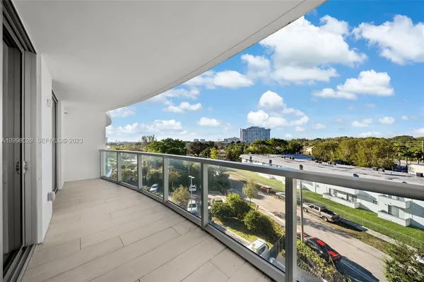 a view of balcony with furniture