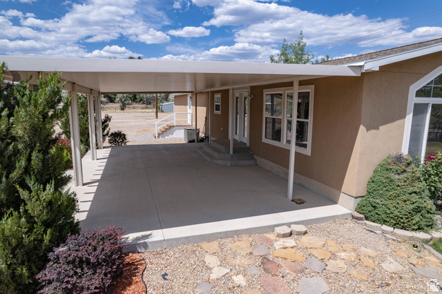 1407 North 1250th Street West Helper, UT 84526 - Photo 2 of 27 View of patio / terrace with entry steps