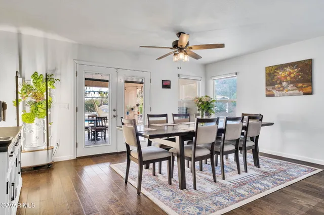 a view of a dining room with furniture and a rug