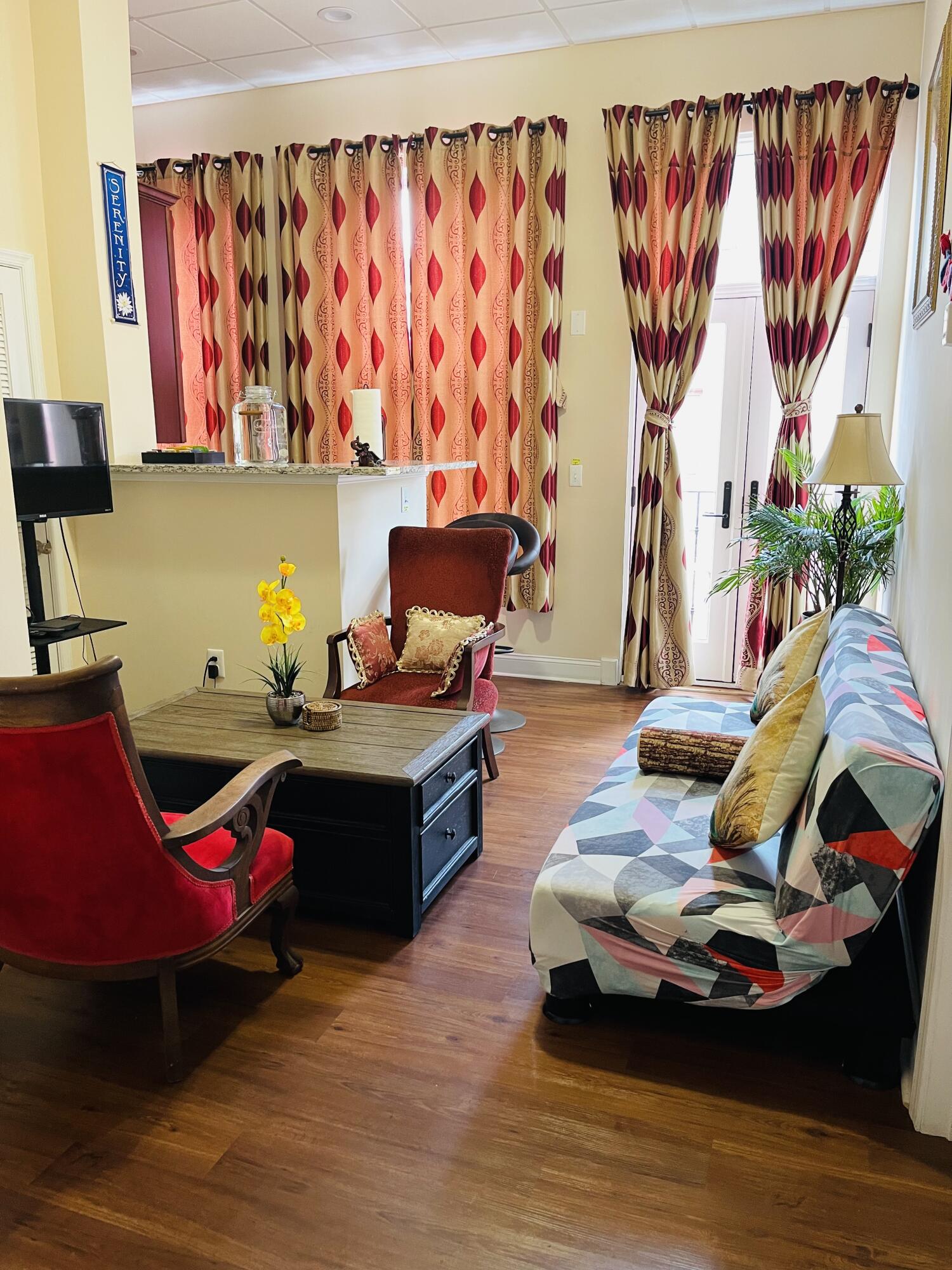 100 Kirk Avenue Southeast, Unit 2B Roanoke, VA 24011 - Photo 2 of 8 a living room with furniture and a wooden floor
