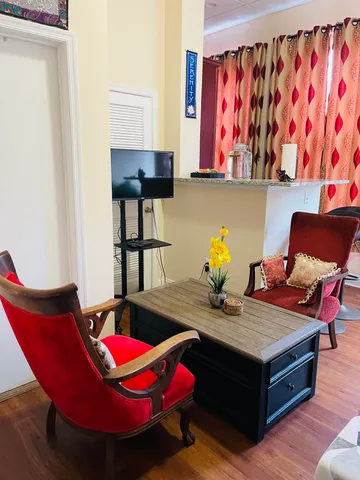 a room with furniture and wooden floor