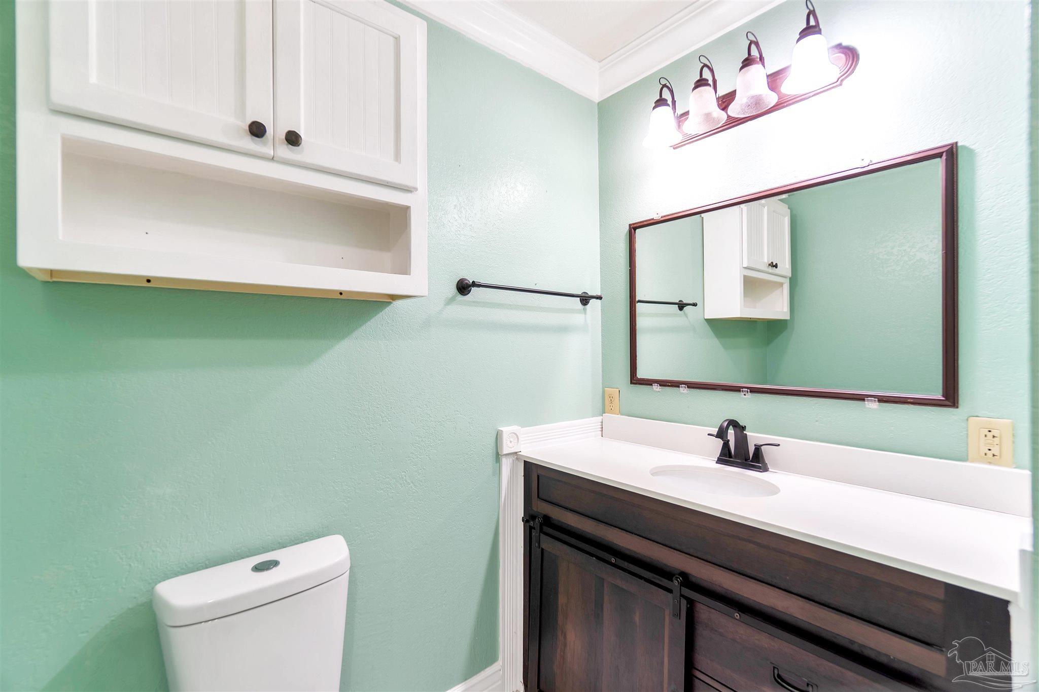 1961 Guseman Road Gulf Breeze, FL 32563 - Photo 14 of 37 a bathroom with a sink and a toilet