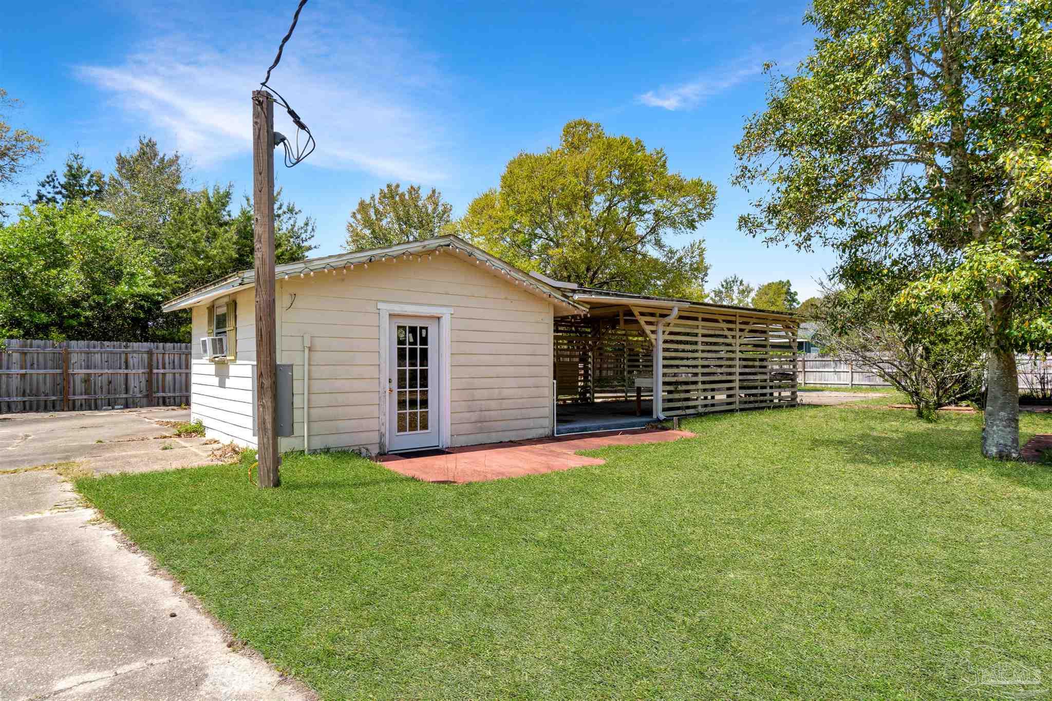 1961 Guseman Road Gulf Breeze, FL 32563 - Photo 18 of 37 a view of a backyard with a house