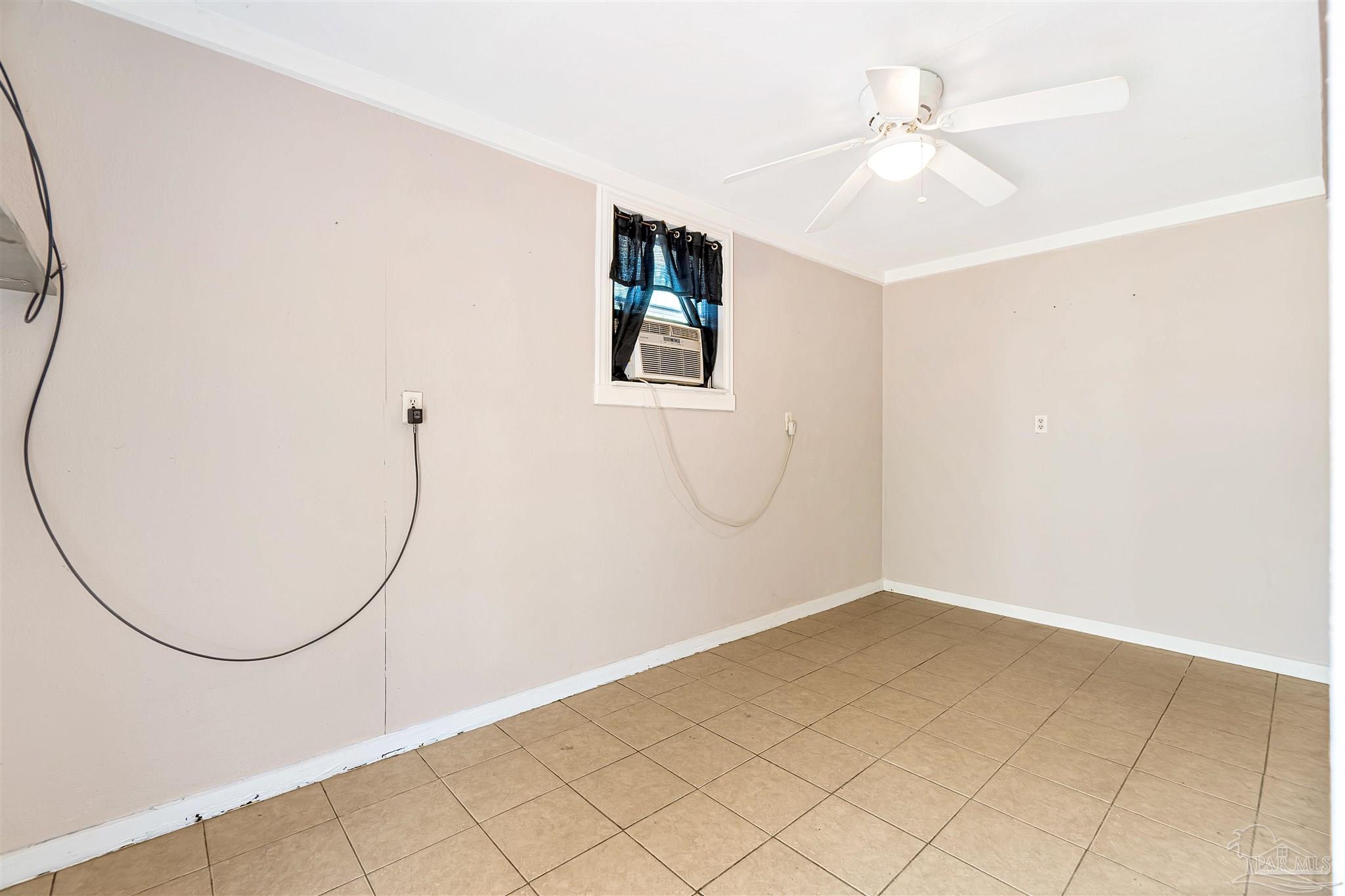 1961 Guseman Road Gulf Breeze, FL 32563 - Photo 20 of 37 an empty room with windows