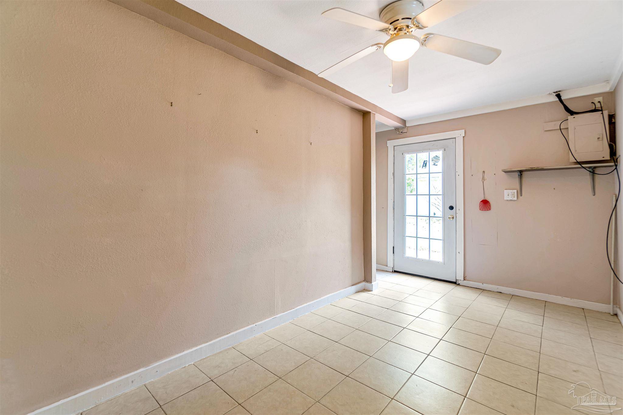 1961 Guseman Road Gulf Breeze, FL 32563 - Photo 21 of 37 wooden floor in an empty room with a window