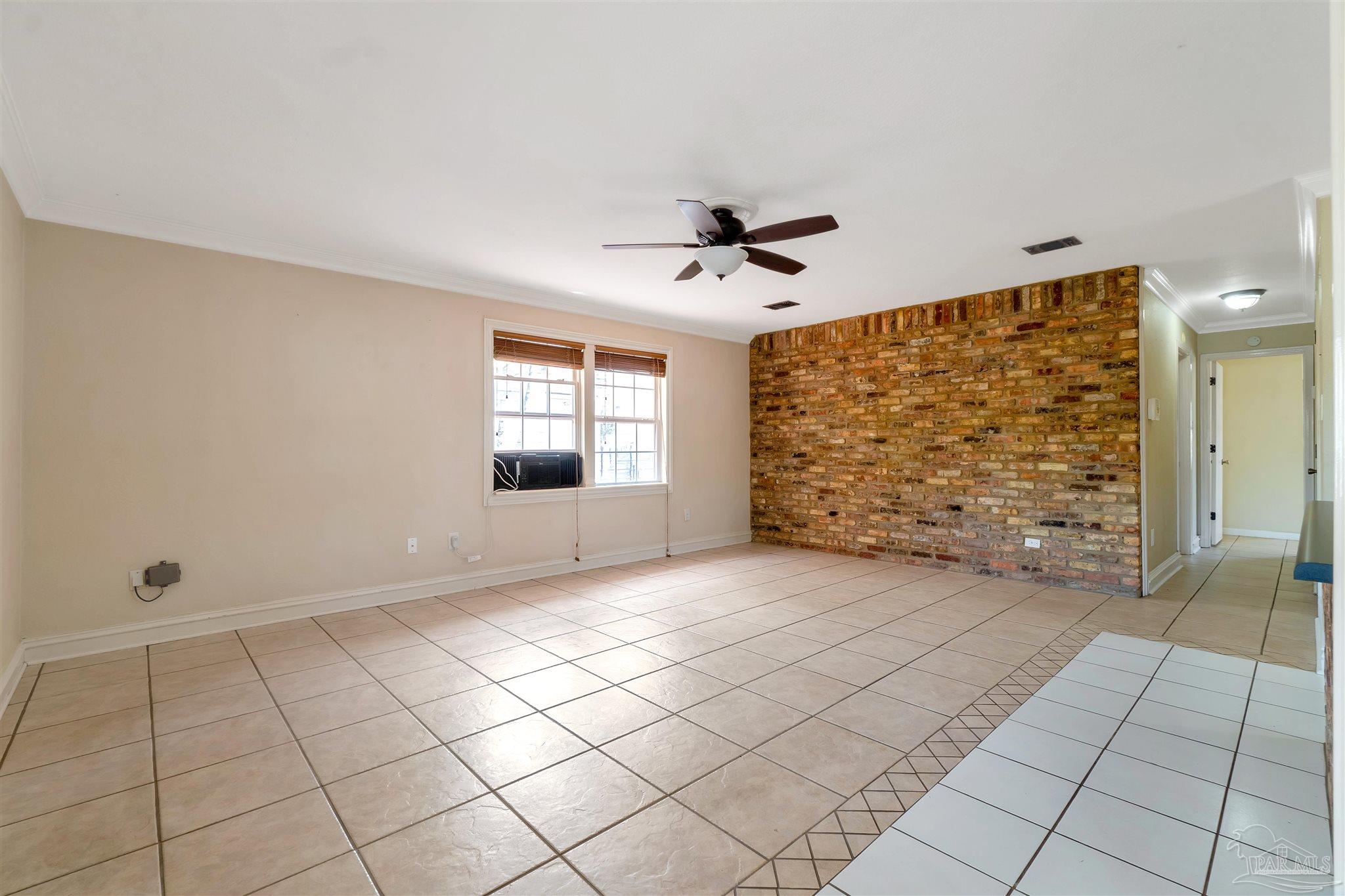 1961 Guseman Road Gulf Breeze, FL 32563 - Photo 3 of 37 a view of an empty room with a window