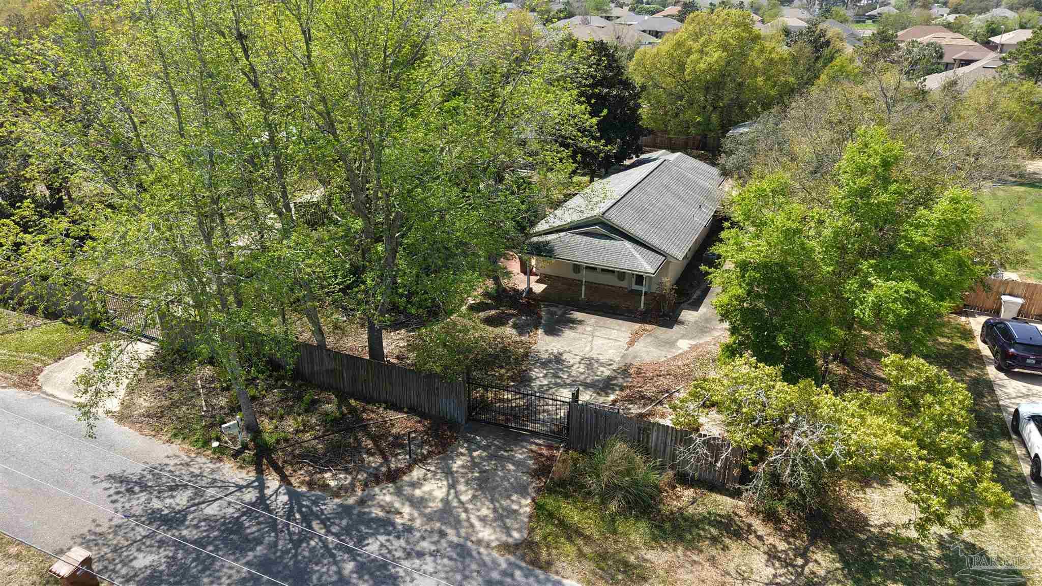 1961 Guseman Road Gulf Breeze, FL 32563 - Photo 35 of 37 a view of a garden with plants and large trees