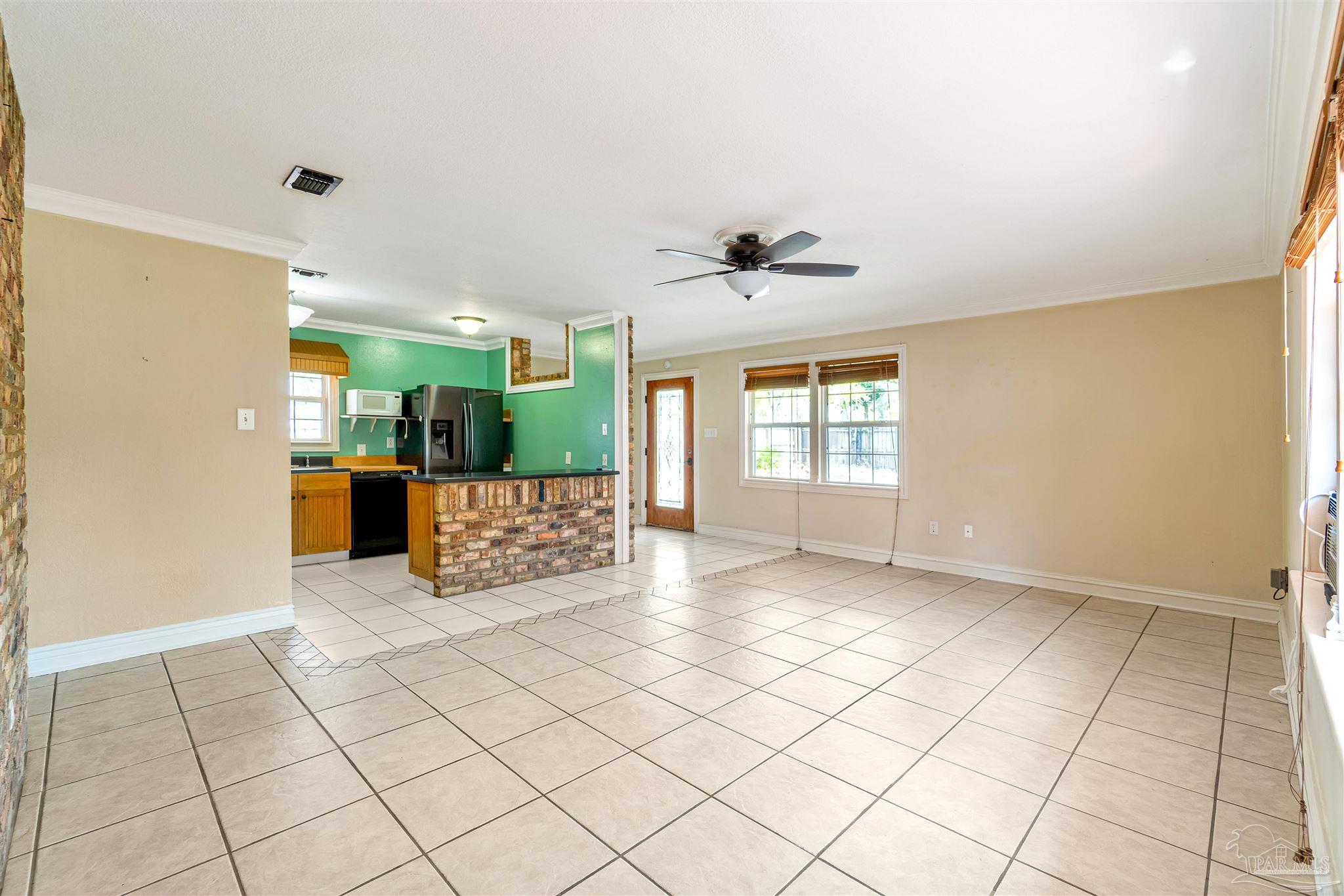 1961 Guseman Road Gulf Breeze, FL 32563 - Photo 5 of 37 a view of an empty room and window