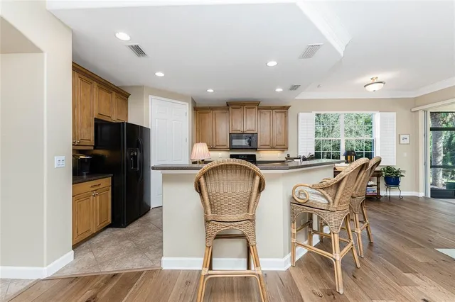 a living room with furniture fireplace and a table