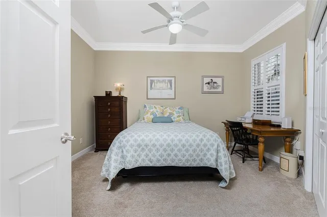 a view of a dining room with furniture water view and a large window
