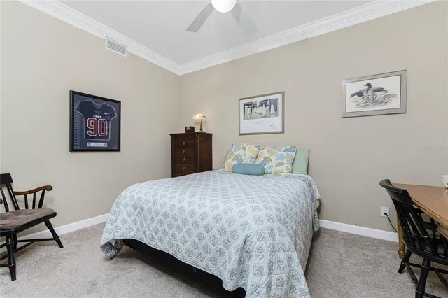 a dining room with furniture a chandelier and glass door