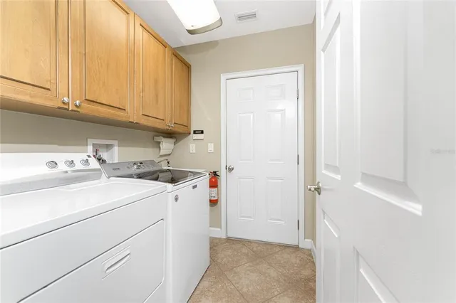 a living room with large windows and furniture