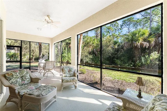 a front view of a house with a yard and ocean view